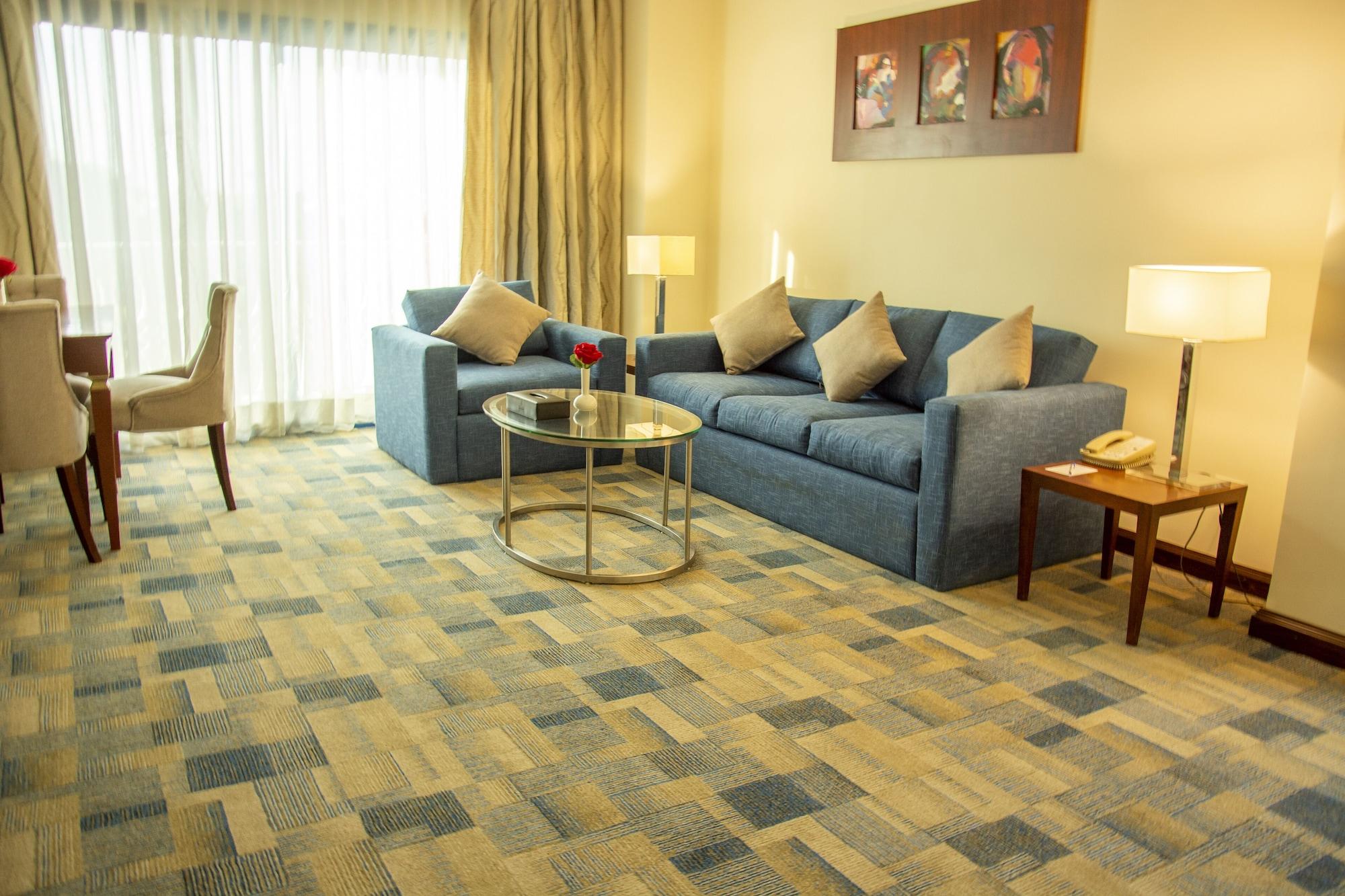 Helnan Dream Hotel And Conference Center 6th of October City Exterior photo A living room with carpet flooring